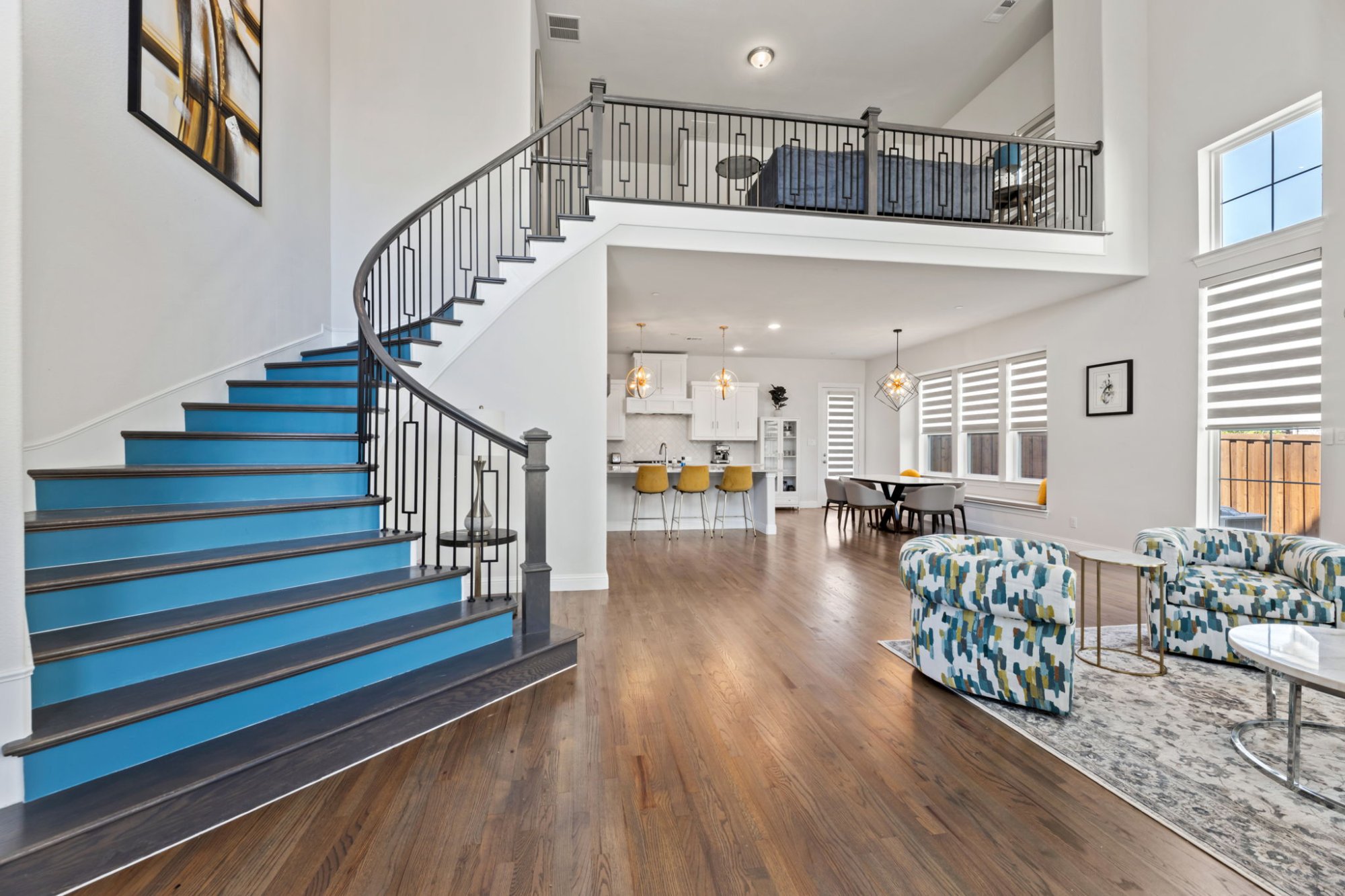 Luxury interior with curved staircase — HostStarter managed