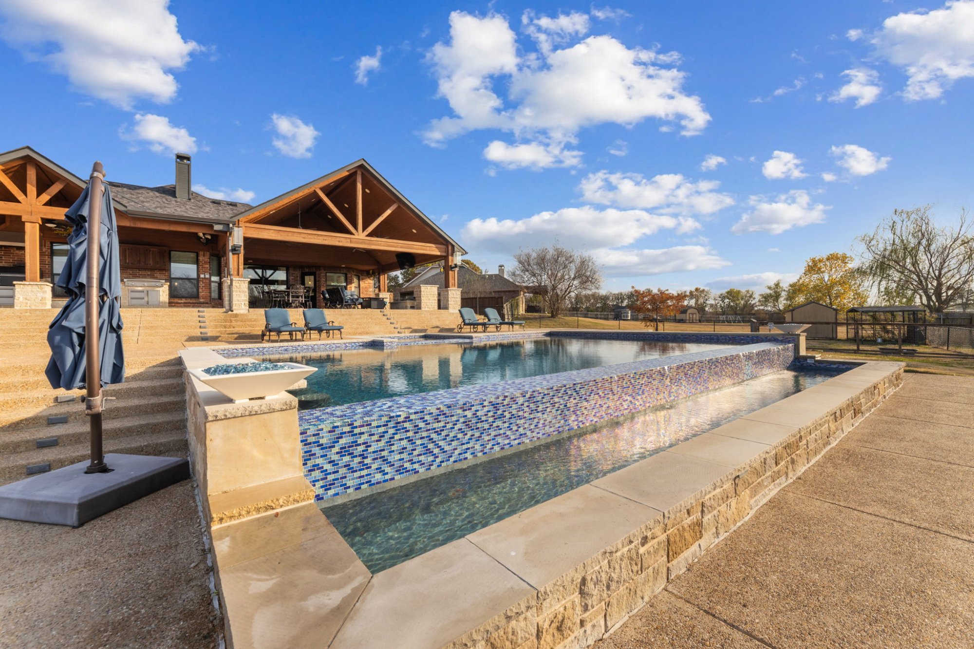 Luxury infinity pool and covered pavilion — HostStarter managed